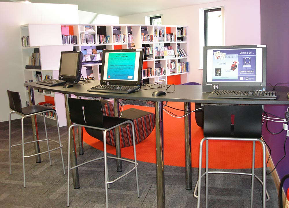 Bar-height IT desk and accent flooring define teensâ€™ area, Wellington Library