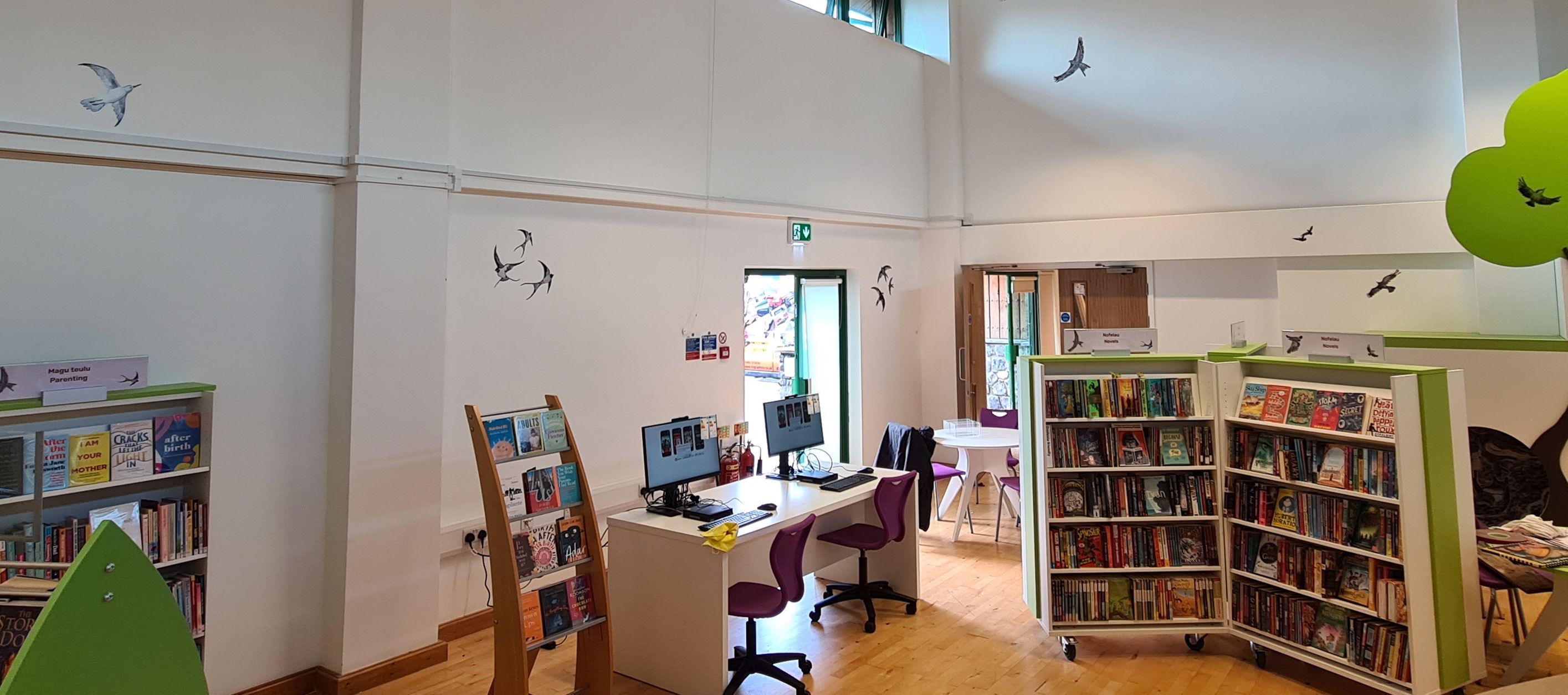 Bird graphics on walls above children’s library