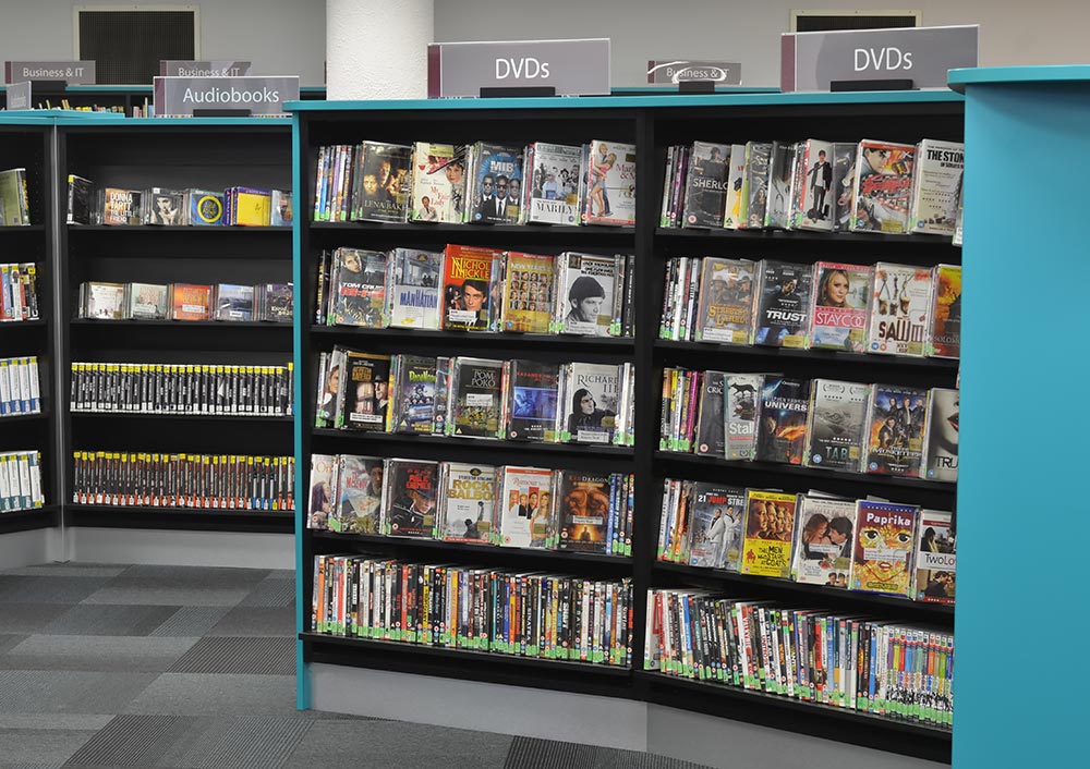 On-shelf Perspex zig-zags support DVDs and audiobooks, Redbridge Library